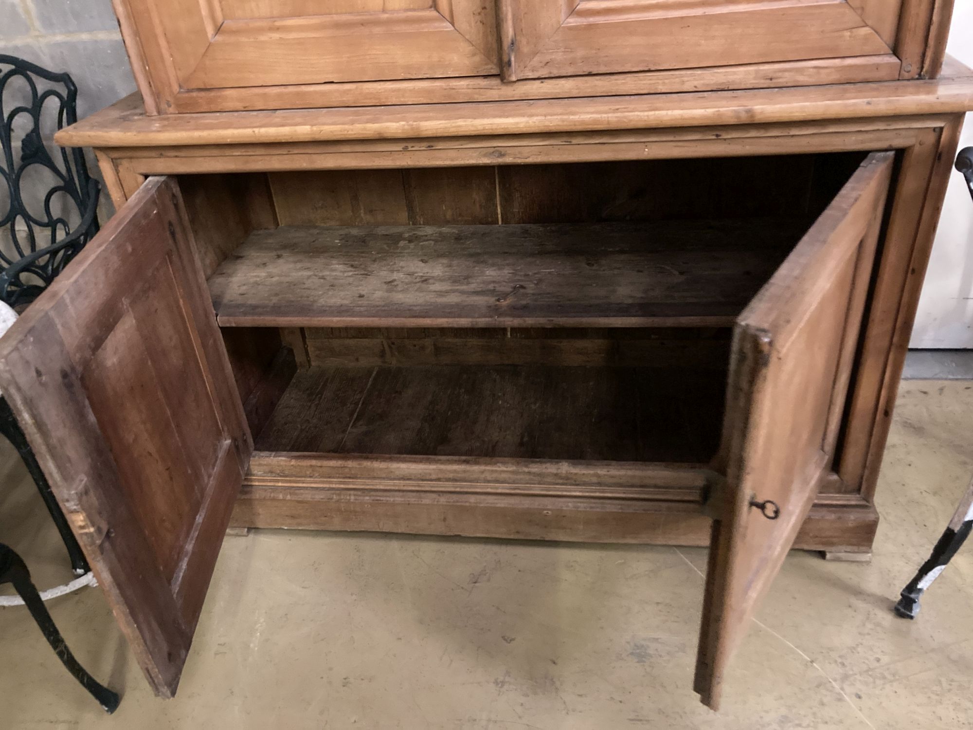 An early 19th century French cherry four door buffet, length 138cm, depth 54cm, height 226cm